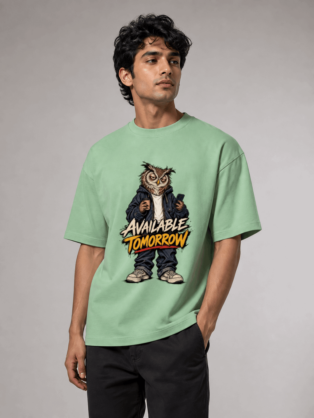 Available Tomorrow Owl jade oversized T-shirt on Indian male model, three-quarter studio view