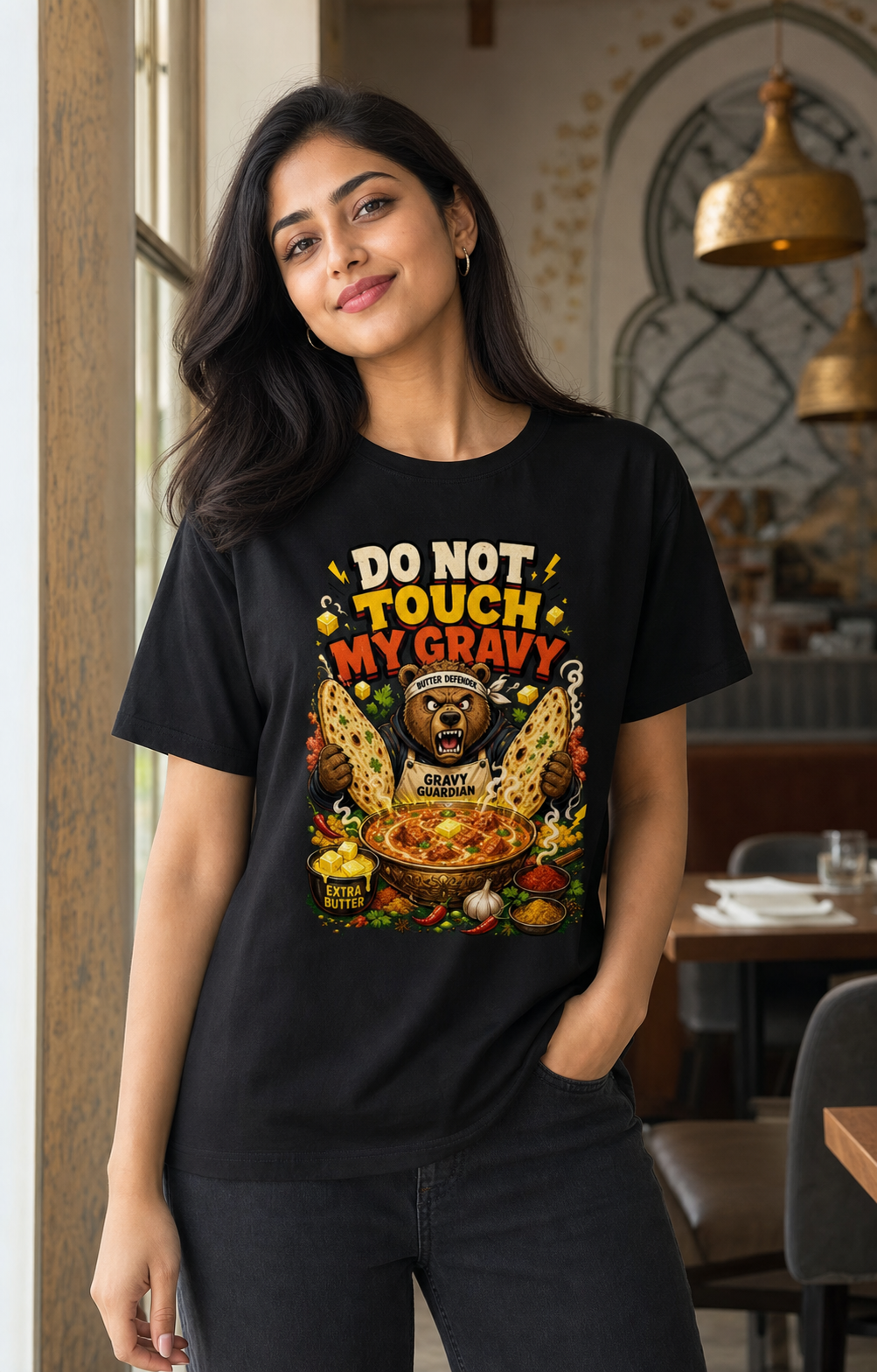 Butter Chicken Bear black Supima cotton DTG T-shirt on Indian female model, approximately 168 cm wearing size M