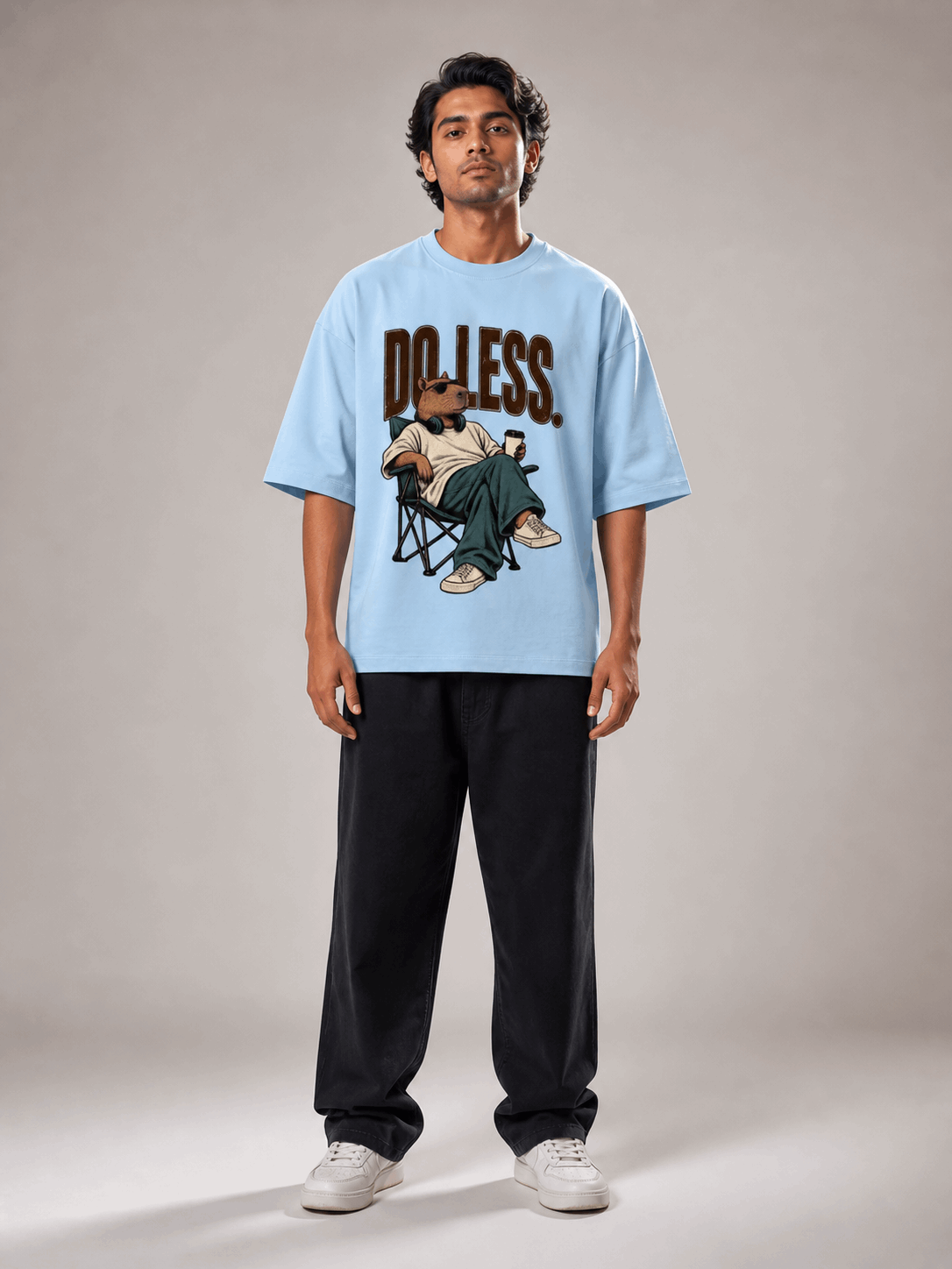 Do Less Capybara baby blue oversized T-shirt on Indian male model, full-length studio view