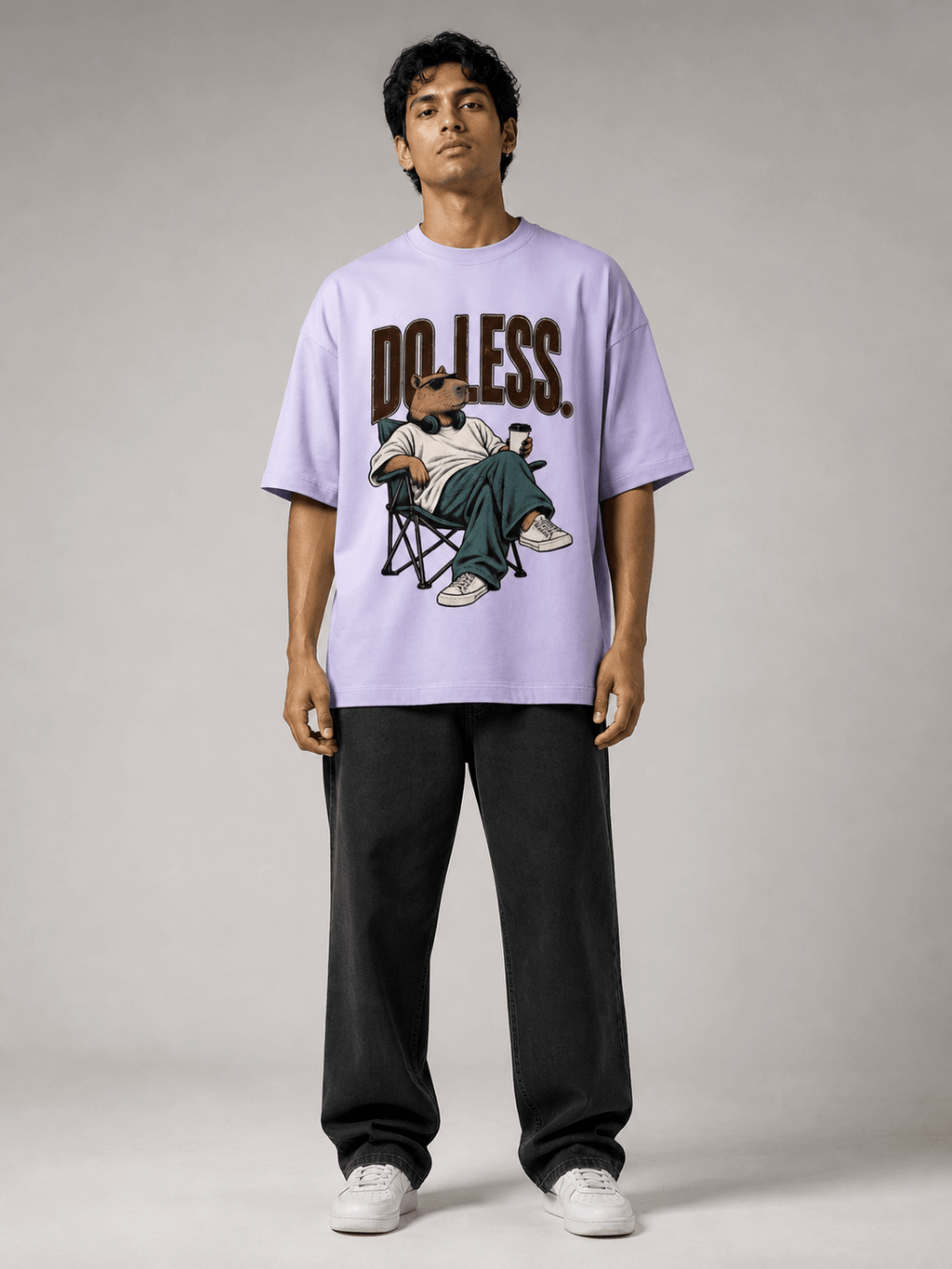 Do Less Capybara lavender oversized T-shirt on Indian male model, full-length studio view
