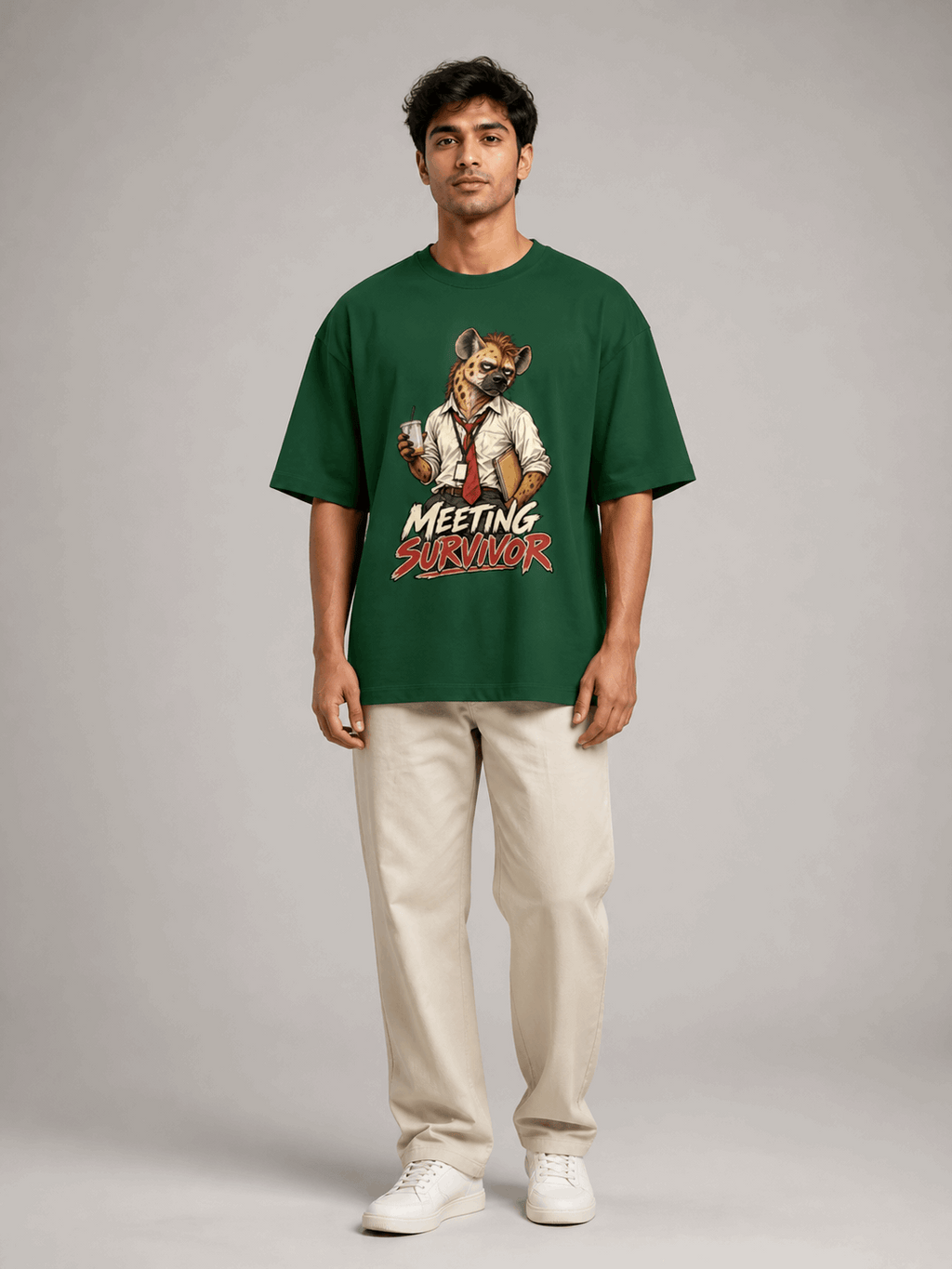 Meeting Survivor Hyena bottle green oversized T-shirt on Indian male model, full-length studio view