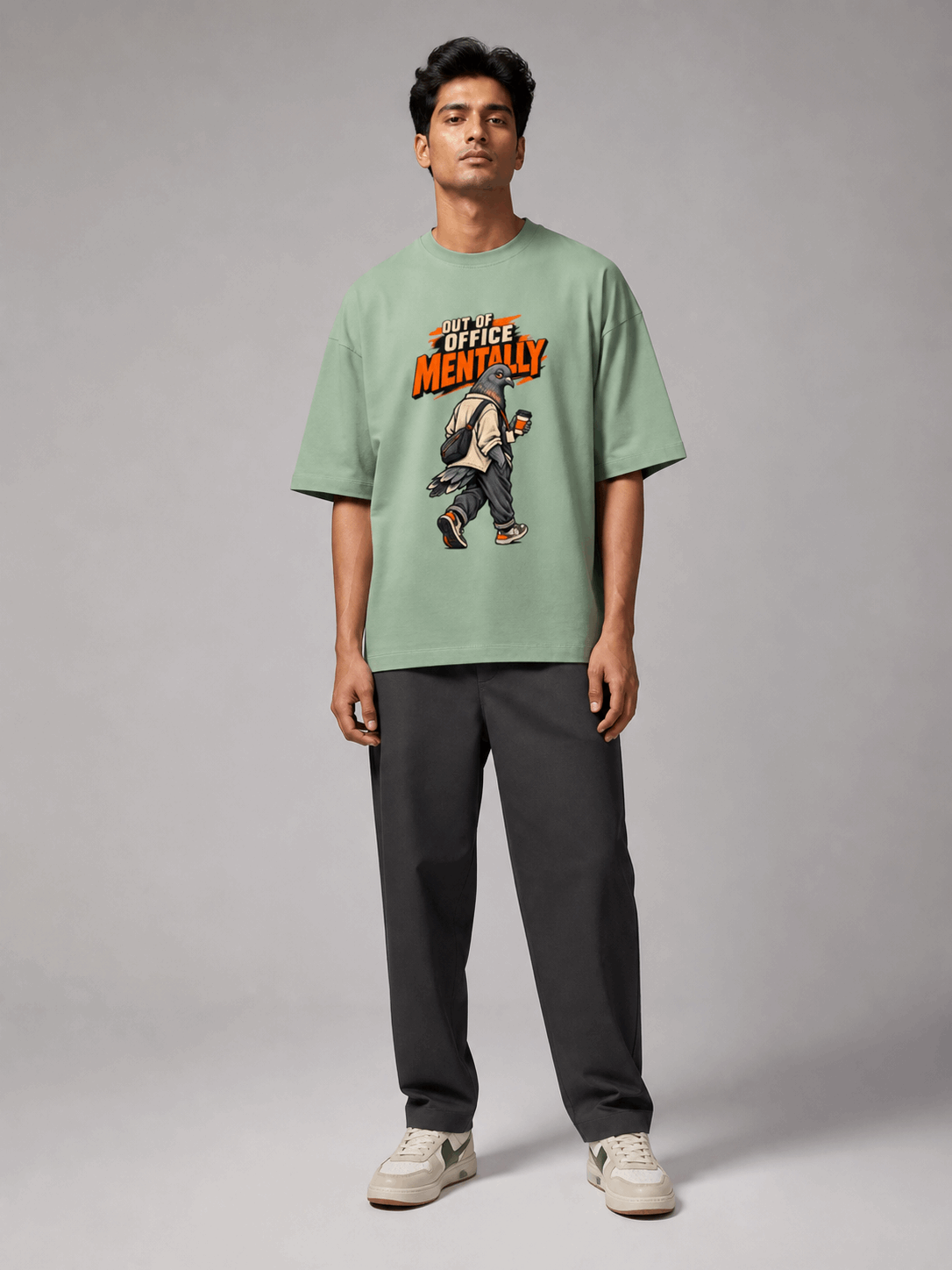Out Of Office Pigeon jade oversized T-shirt on Indian male model, full-length studio view