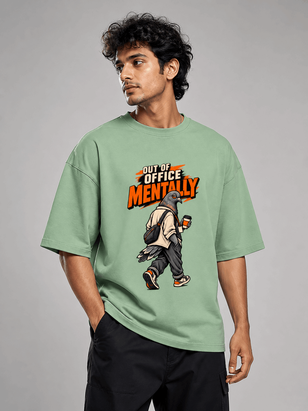 Out Of Office Pigeon jade oversized T-shirt on Indian male model, three-quarter studio view