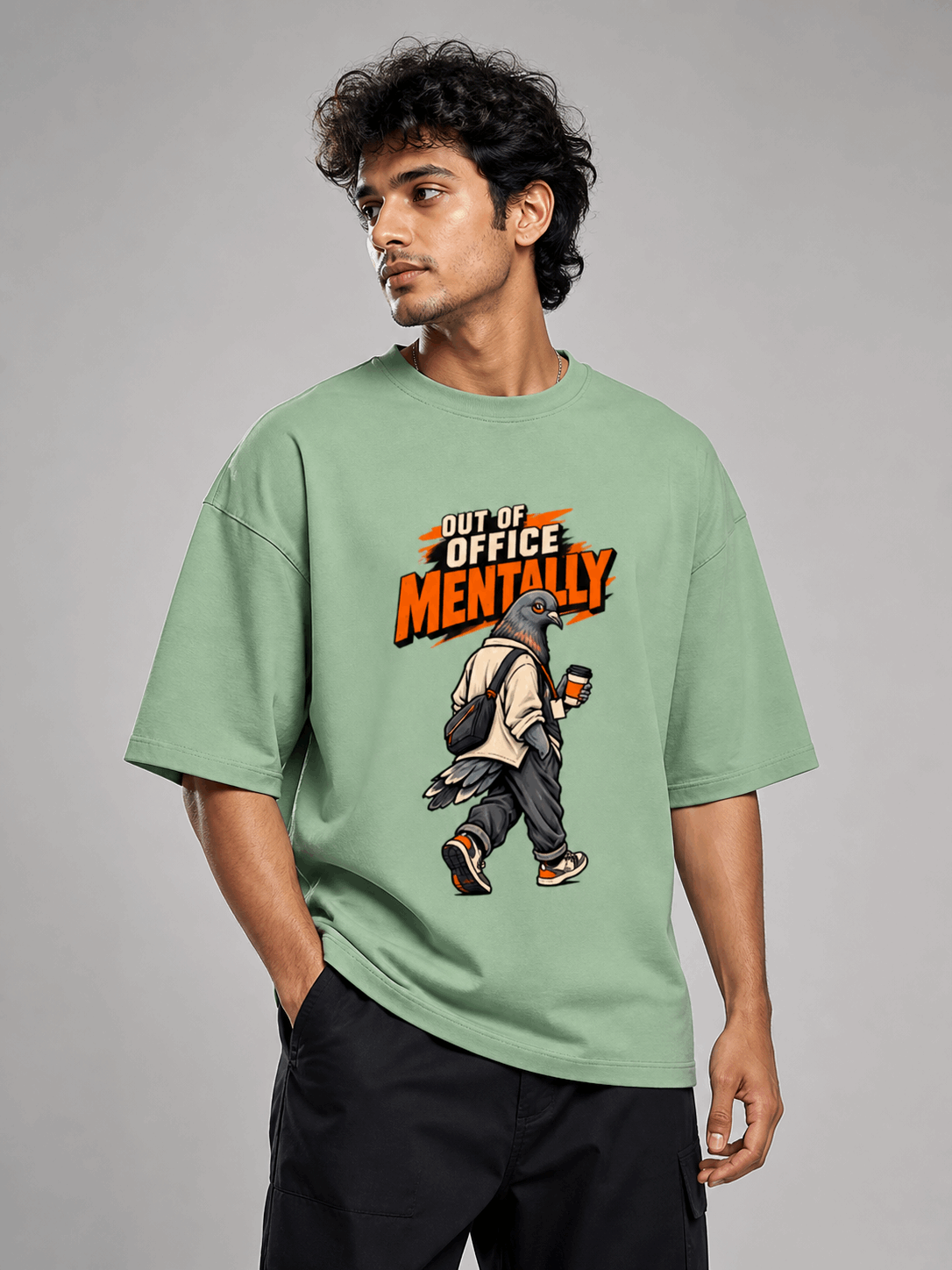 Out Of Office Pigeon jade oversized T-shirt on Indian male model, three-quarter studio view