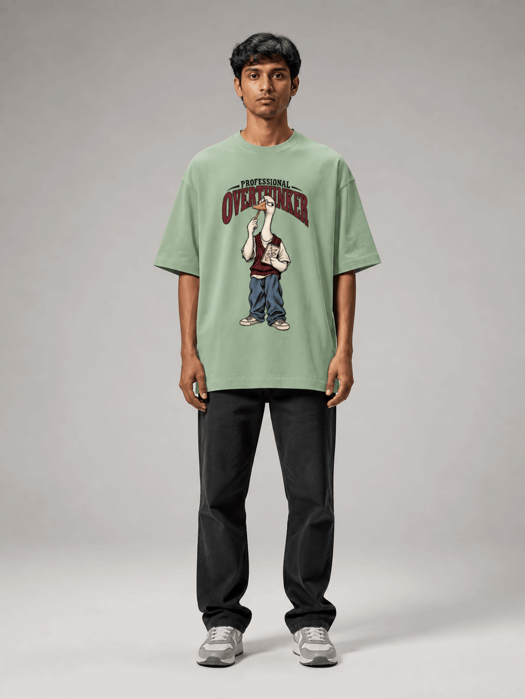 Professional Overthinker Goose jade oversized T-shirt on Indian male model, full-length studio view