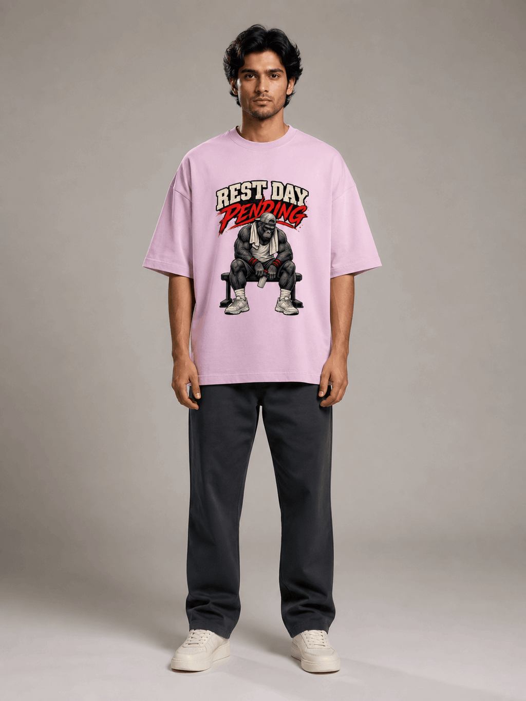 Rest Day Pending Gorilla light baby pink oversized T-shirt on Indian male model, full-length studio view