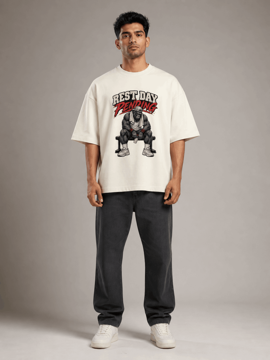 Rest Day Pending Gorilla off white oversized T-shirt on Indian male model, full-length studio view