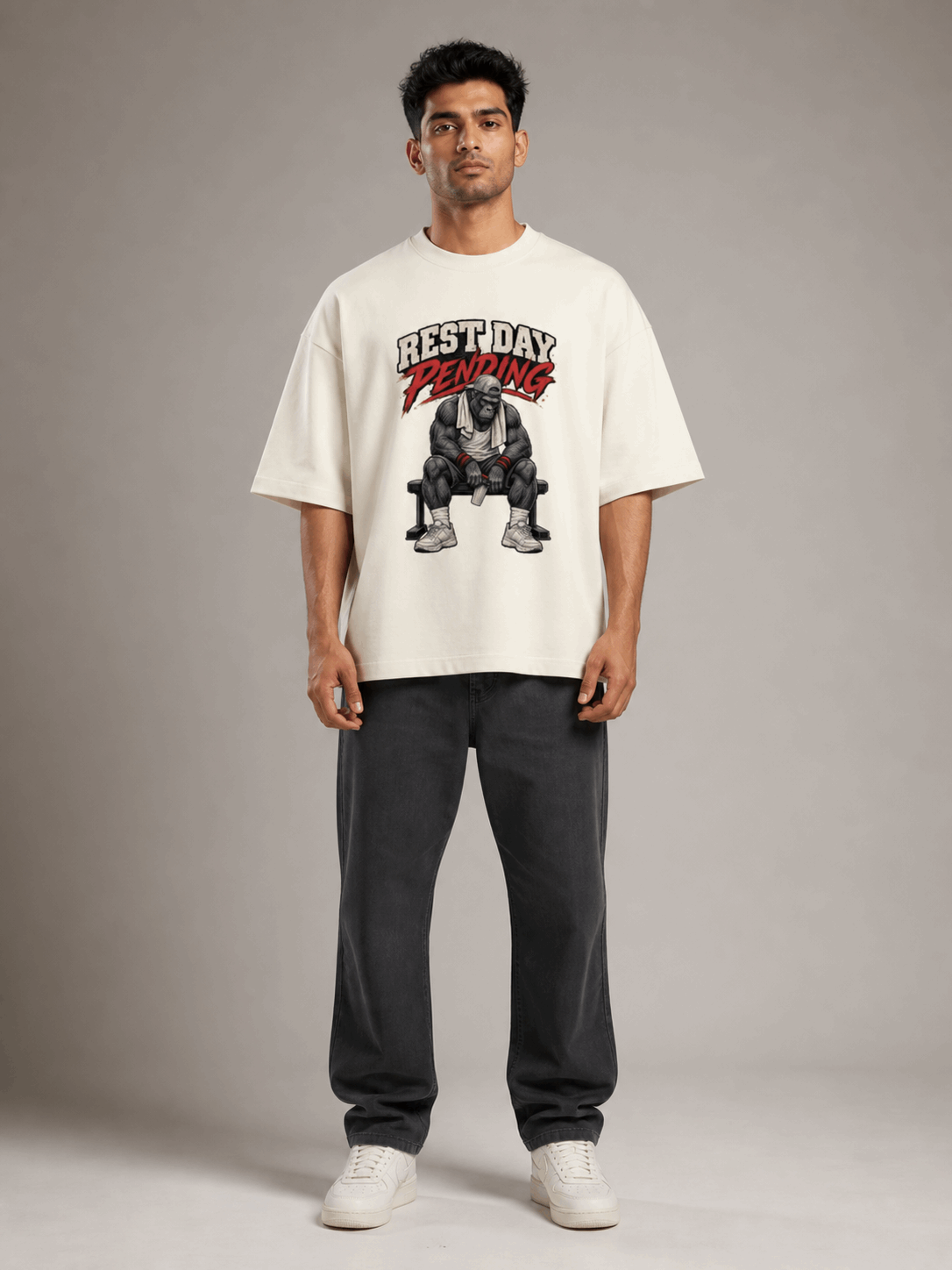 Rest Day Pending Gorilla off white oversized T-shirt on Indian male model, full-length studio view