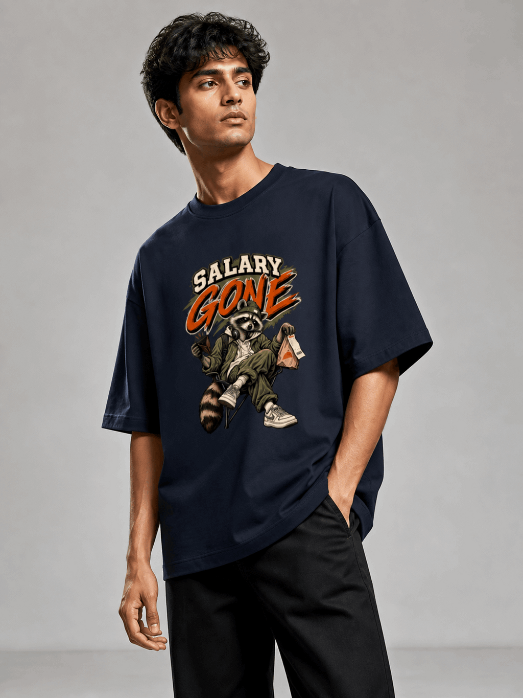 Salary Gone Raccoon navy blue oversized T-shirt on Indian male model, three-quarter studio view