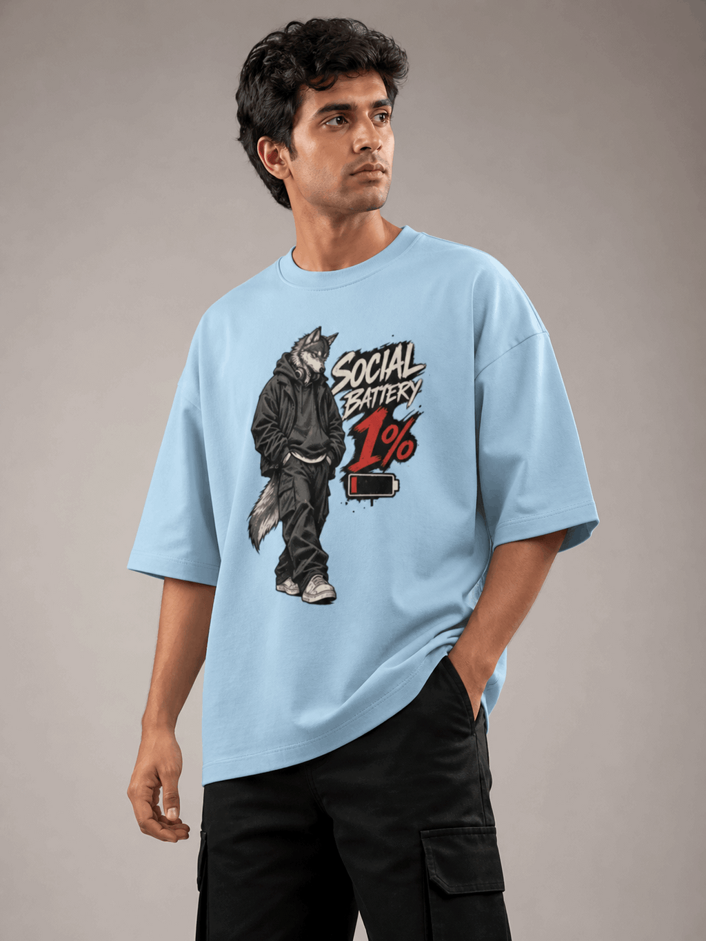 Social Battery Wolf baby blue oversized T-shirt on Indian male model, three-quarter studio view