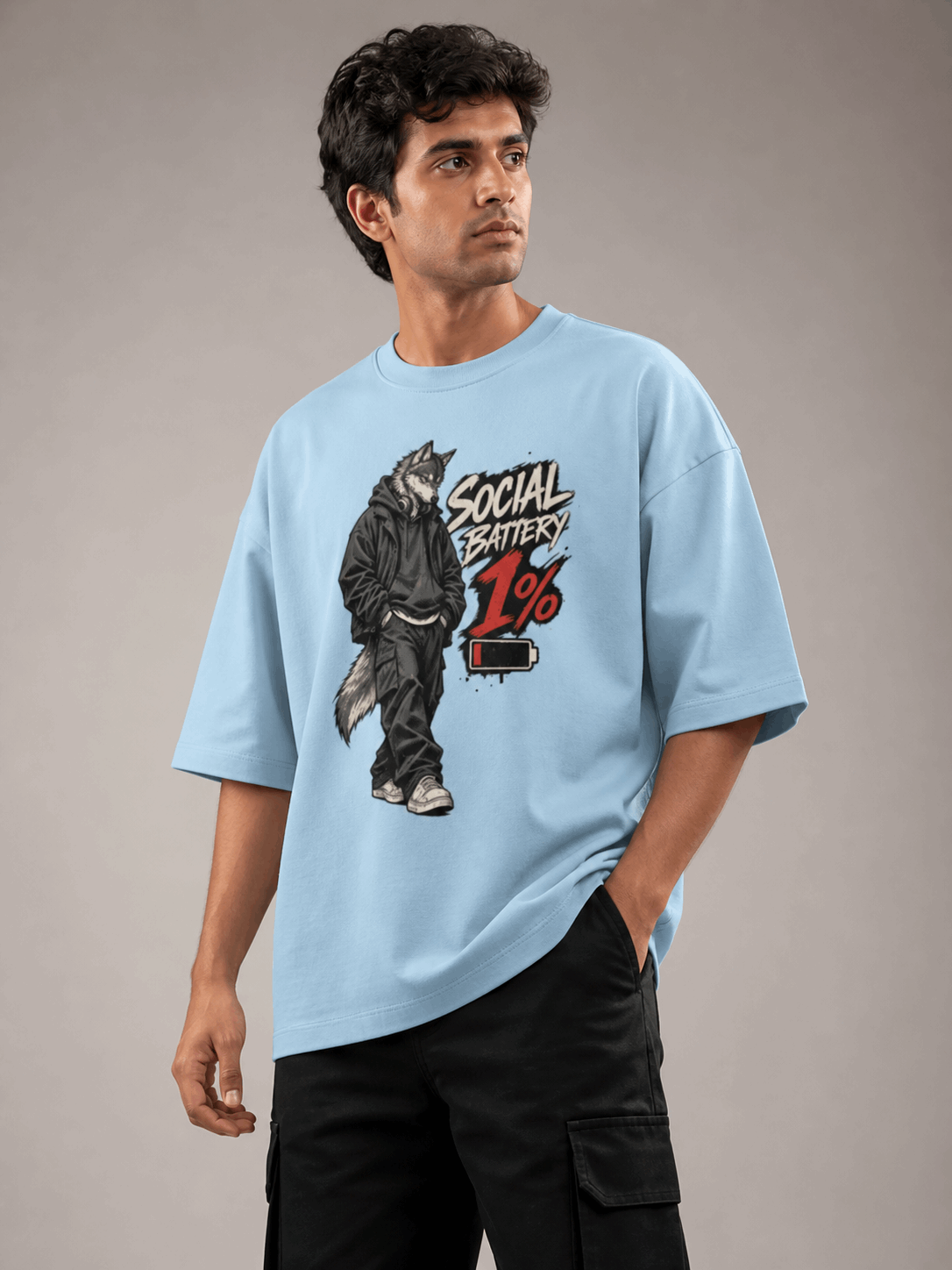 Social Battery Wolf baby blue oversized T-shirt on Indian male model, three-quarter studio view