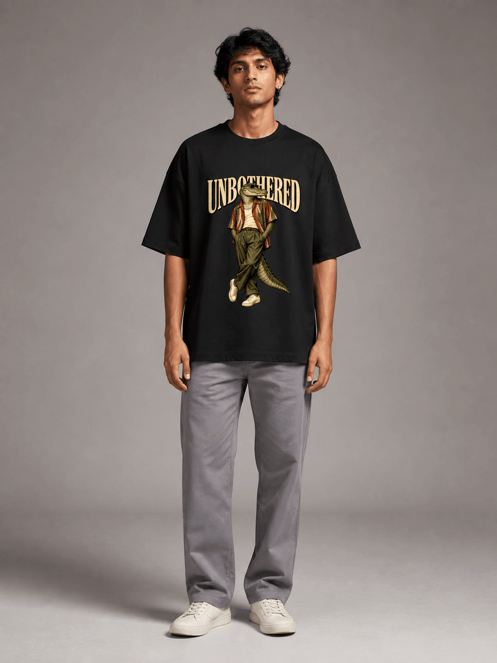 Unbothered Crocodile black oversized T-shirt on Indian male model, full-length studio view