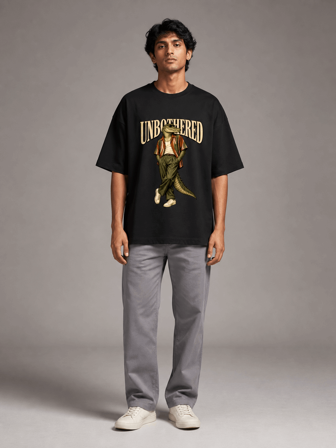 Unbothered Crocodile black oversized T-shirt on Indian male model, full-length studio view