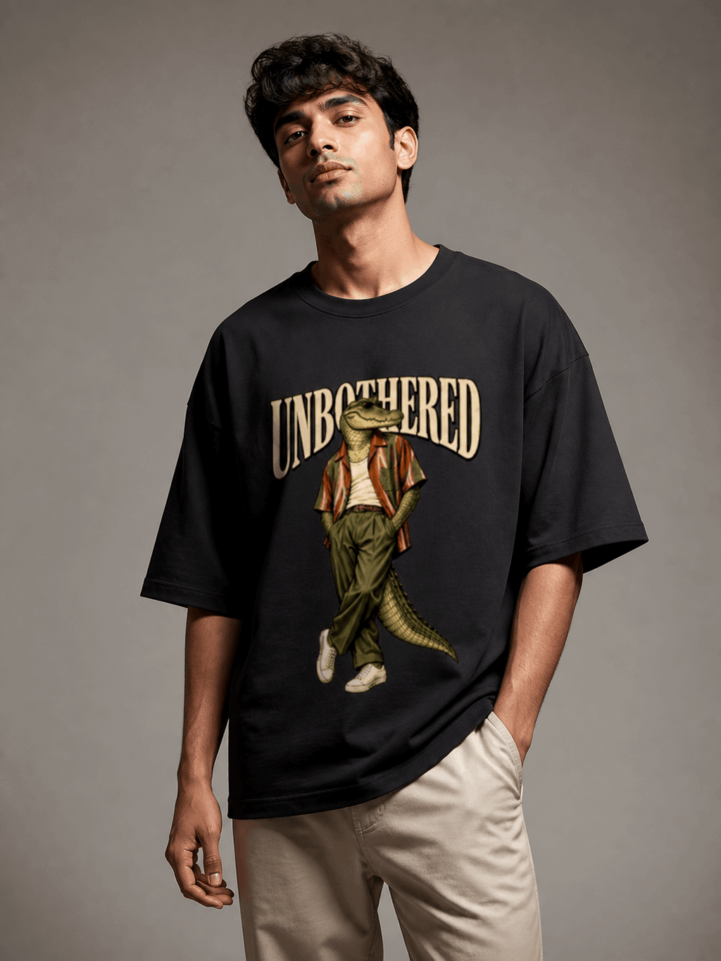 Unbothered Crocodile black oversized T-shirt on Indian male model, three-quarter studio view