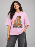 Taking My Sweet Time Capybara Light Baby Pink oversized T-shirt on an Indian female model, front studio view