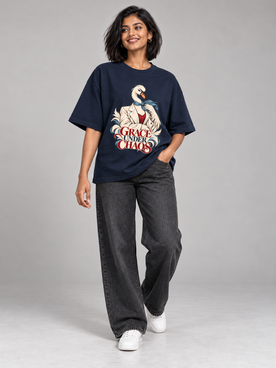 Grace Under Chaos Swan Navy Blue oversized T-shirt on an Indian female model, full-length studio view